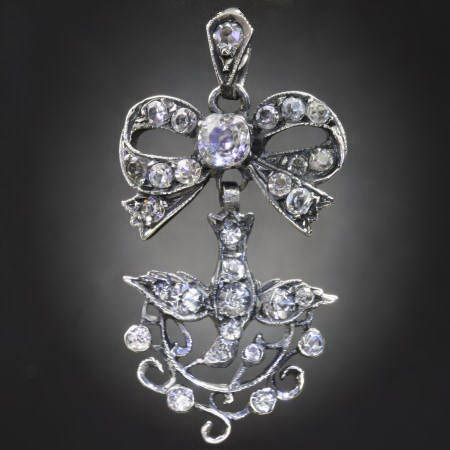 SILVER SAINT ESPRIT & BOW PENDANT